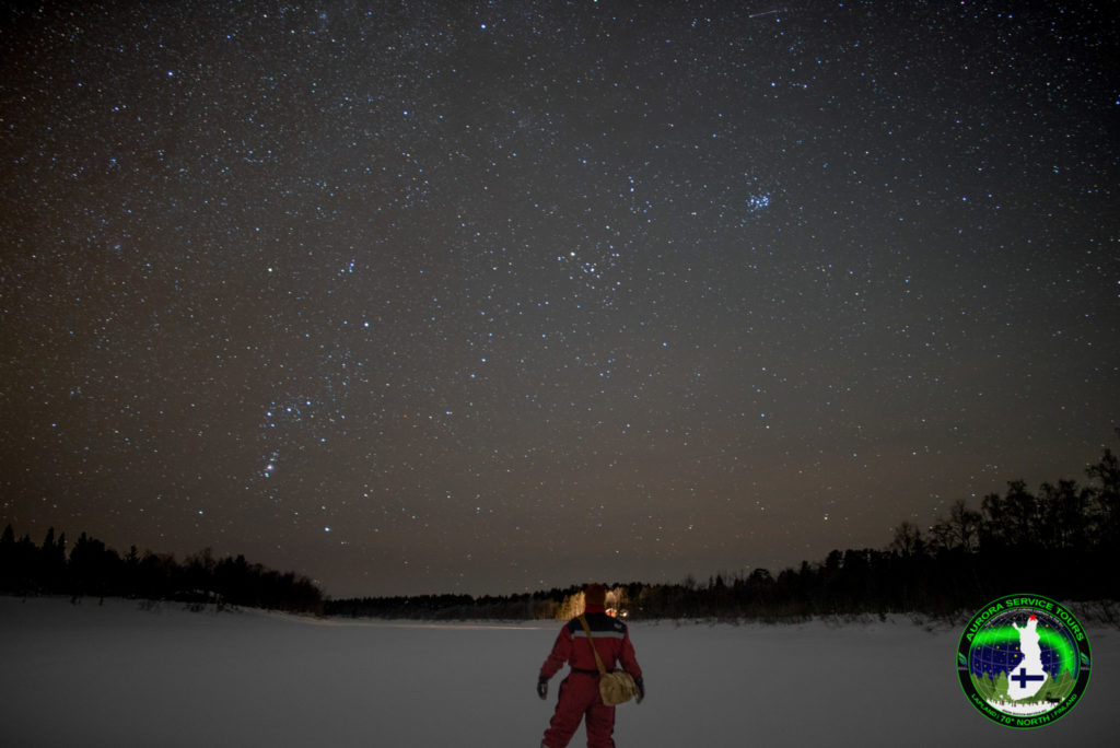 Stood under starry skies on river in Lapland