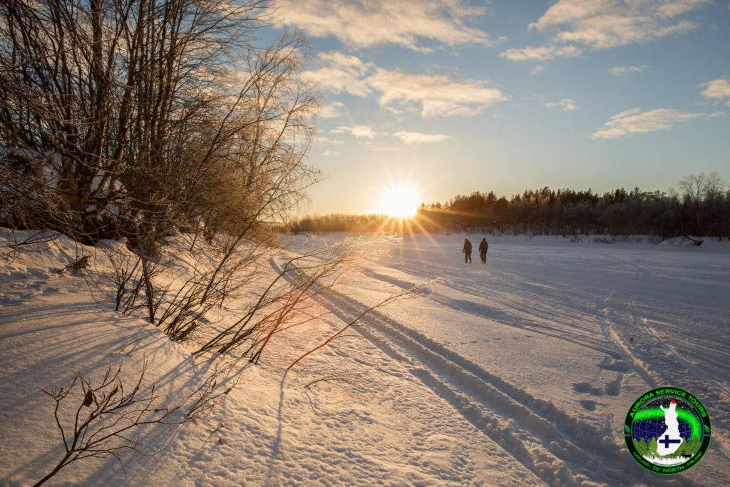 Walks along the frozen river in Lapland
