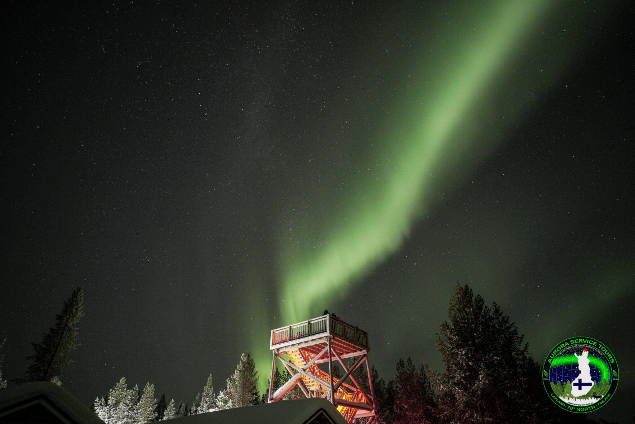 standing under the northern lights in Lapland