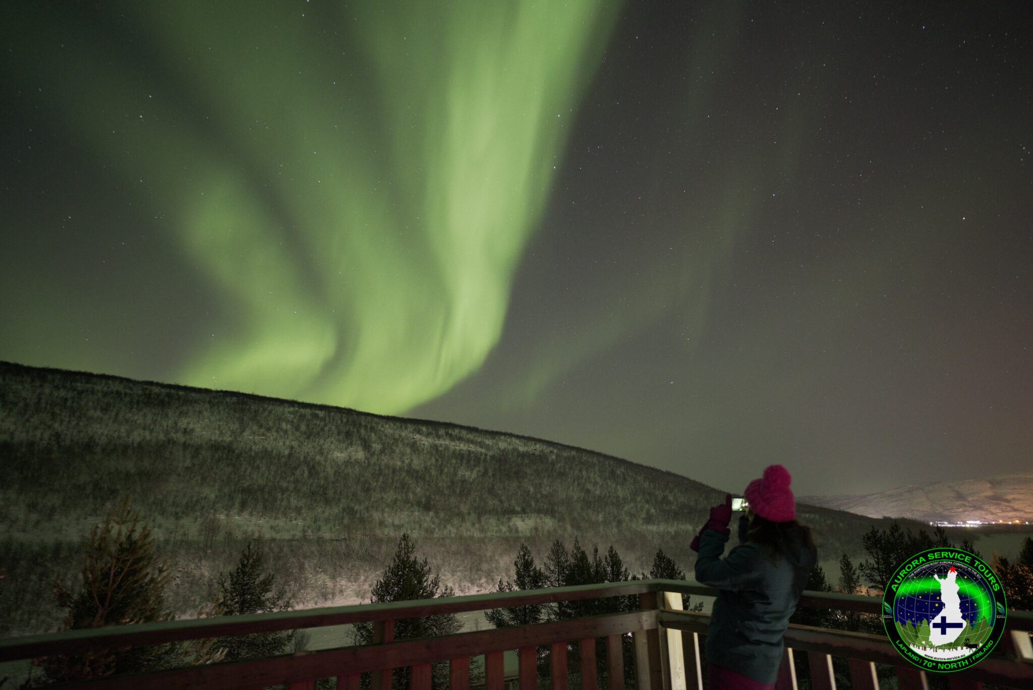 standing under the northern lights in Lapland