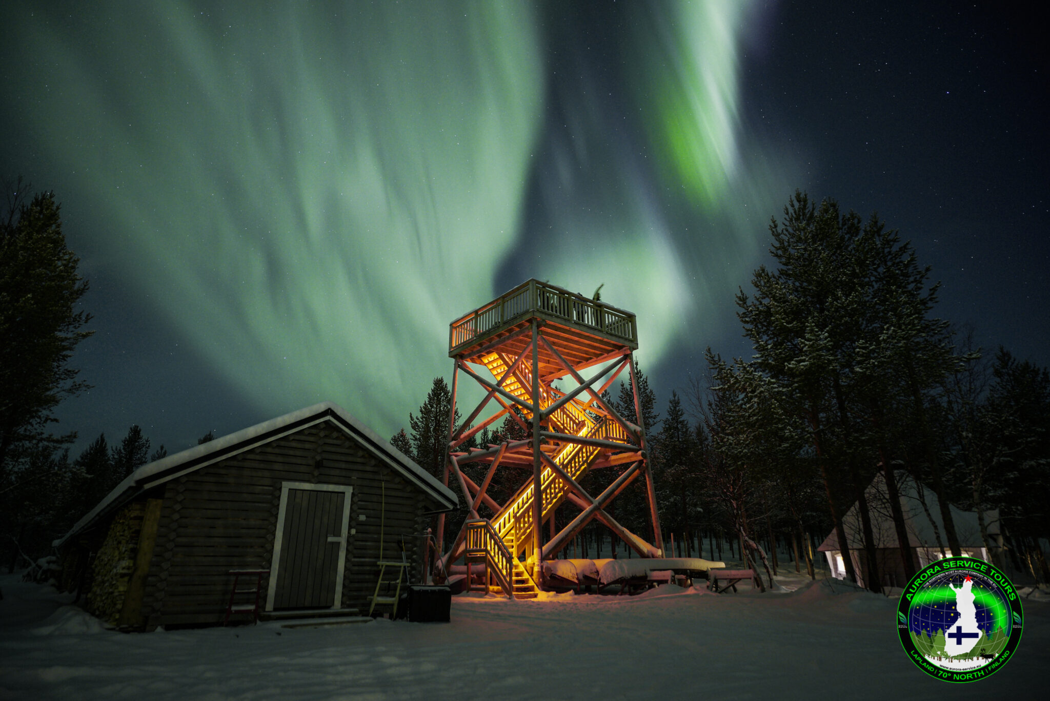 standing under the northern lights in Lapland