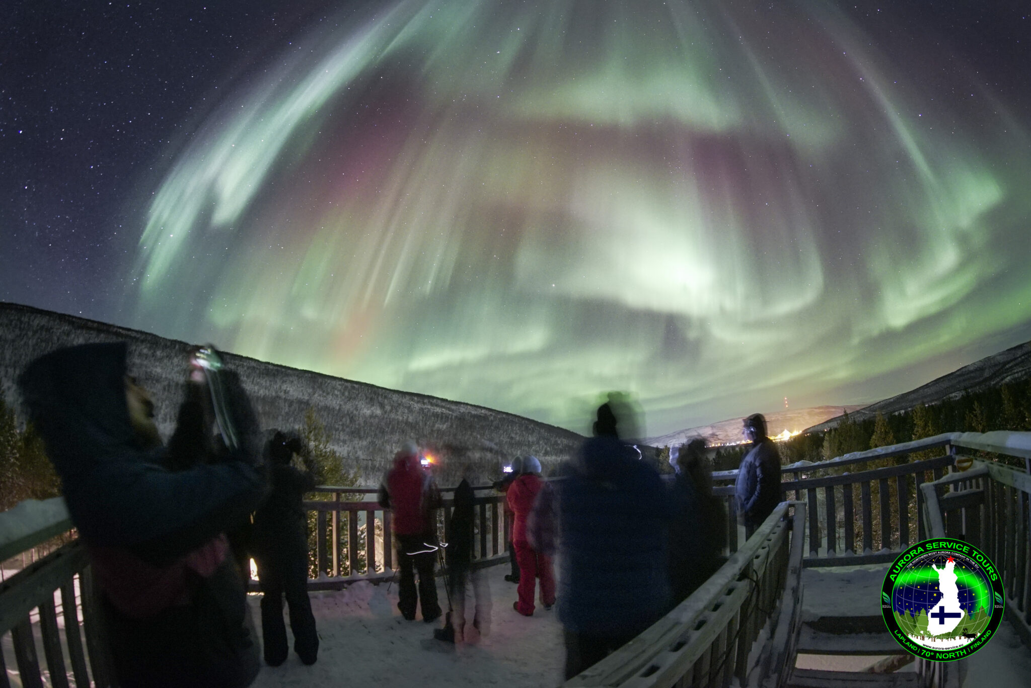 standing under the northern lights in Lapland