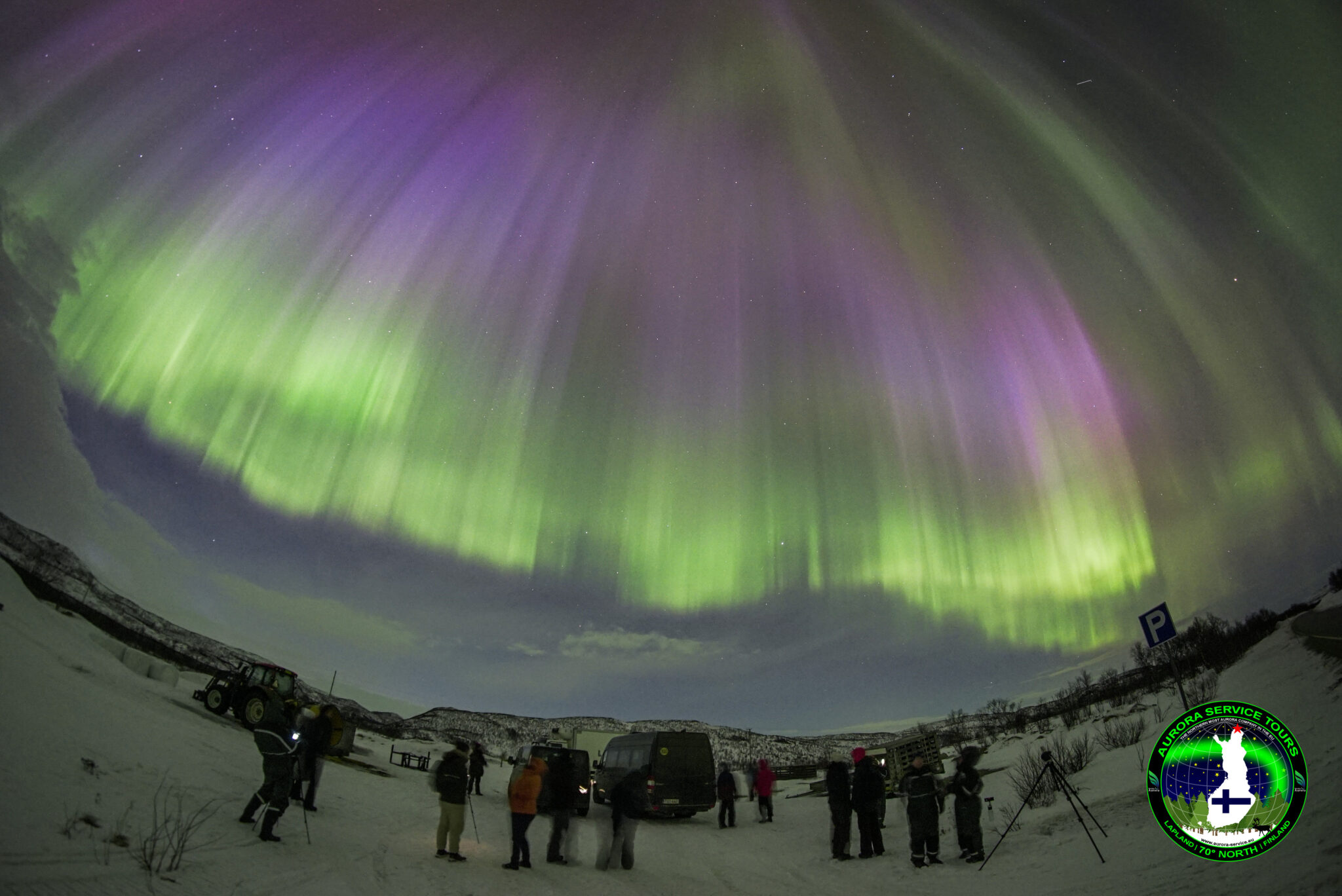 standing under the northern lights in Lapland